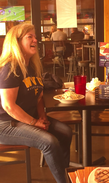Laura, WVU Mom celebrating birthday at game watch